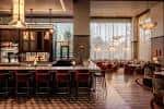 Interior elegante del restaurante Bacco en Nashville con barra de bar y mesas acogedoras