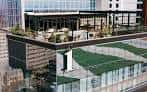 Exterior del edificio mostrando la terraza superior en un entorno urbano