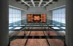Interior moderno del museo con exhibición central iluminada y estructura arquitectónica contemporánea