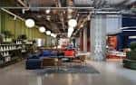 Espacio comunitario interior con mobiliario moderno y diseño industrial