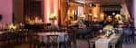 Interior del The Stave Room decorado para una boda con mesas redondas y velas