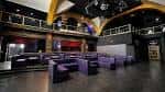 Interior del Believe Music Hall con zona de eventos y mobiliario moderno