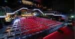 Interior del auditorio NX Newcastle con butacas rojas dispuestas para un evento