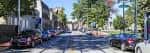 Vista panorámica de Germantown Avenue con árboles y edificios históricos