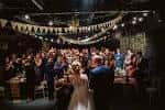 Celebración de boda en el interior del Hope Mill Theatre con invitados y decoración festiva