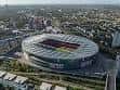 Vista aérea del Emirates Stadium en Londres, mostrando su estructura ovalada y el campo de juego