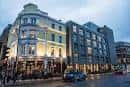 Fachada exterior del Hotel Indigo London Clerkenwell al atardecer