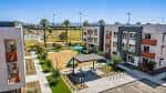 Vista aérea del complejo Residences at Falcon Park con zonas verdes y áreas recreativas