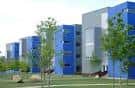 Sección del Hospital Universitario Lucus Augusti con fachadas azules y grises