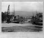 Perspectiva histórica del Muelle del Arenal con embarcaciones tradicionales