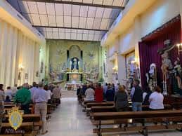 Interior del Santuario de María Auxiliadora con fieles reunidos en misa