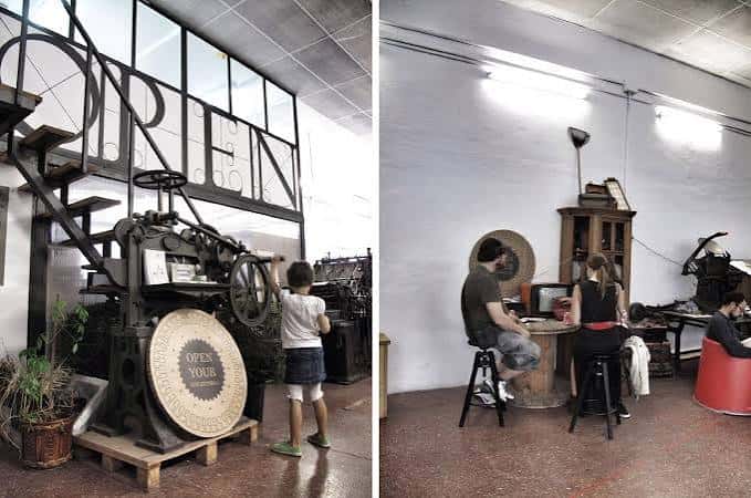 Detalle de maquinaria histórica y zona de trabajo en el interior
