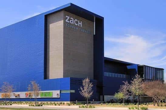 Fachada exterior del Zach Theatre con su distintivo diseño arquitectónico azul y gris