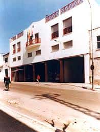 Fachada del antiguo Parque Norte de Bomberos en Granada, con banderas y arquitectura tradicional