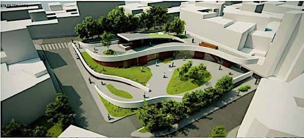 Vista aérea del proyecto arquitectónico que muestra la integración del edificio con espacios verdes y senderos curvos