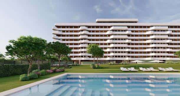 Vista renderizada de la piscina y zona ajardinada frente a los edificios residenciales