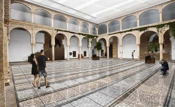 Patio interior con arcos de estilo mudéjar y suelo de mosaico, ideal para eventos culturales