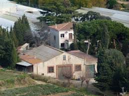 Vista aérea de Can Montasell con sus edificios principales y entorno natural