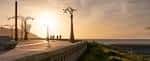 Paseo Marítimo de A Coruña al atardecer con farolas ornamentadas