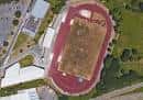 Vista aérea del Estadio Gregorio Pérez Rivera mostrando la pista de atletismo y edificios adyacentes