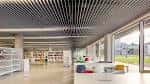 Zona de lectura interior de la Biblioteca Pública del Estado en Ourense con techo moderno y luz natural