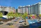 Área pavimentada de la Plaza Elíptica con árboles y edificios