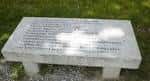 Banco de piedra con inscripciones, parte de una escultura