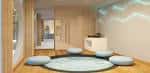 Sala de estar moderna con alfombra circular y cojines, ideal para reuniones informales