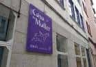 Cartel identificativo de la Casa da Muller en la fachada del edificio
