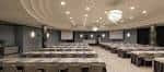 Sala de eventos de hotel con mesas dispuestas para conferencia