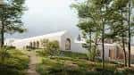 Edificio blanco moderno del museo integrado en el paisaje verde