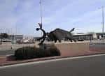 Statue of Els Bous a la Mar in front of the location of the square ...