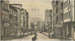 Vista histórica de la Avenida das Caldas con edificios y personas
