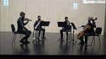 Cuarteto de cuerda actuando en el escenario del conservatorio