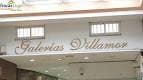Letrero interior de Galerías Villamor en un pasillo comercial
