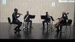 Cuarteto de cuerda actuando en el escenario del conservatorio